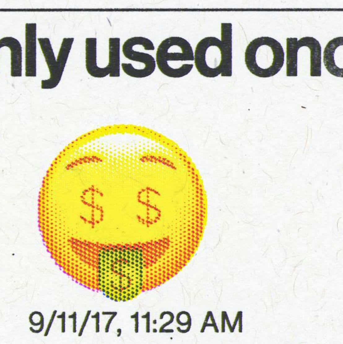 Macro shot of a yellow emoji with dollar signs for eyes and a smile. Caption below reads "only used once" and a timestamp "9/11/17, 11:29 AM", highlighting the print quality of the risograph.