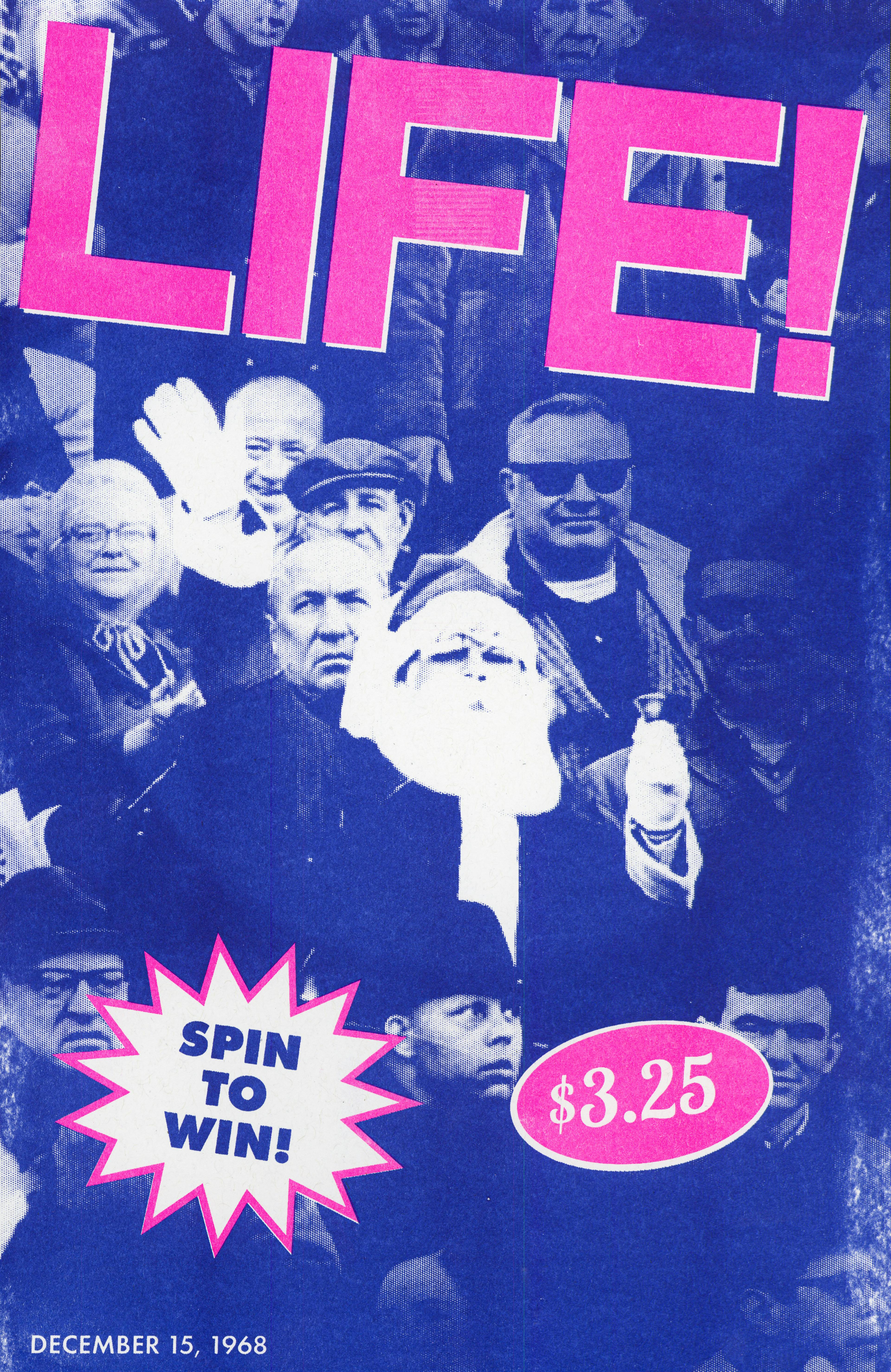 A blue poster with "LIFE" in big pink letters with a picture of Santa Claus