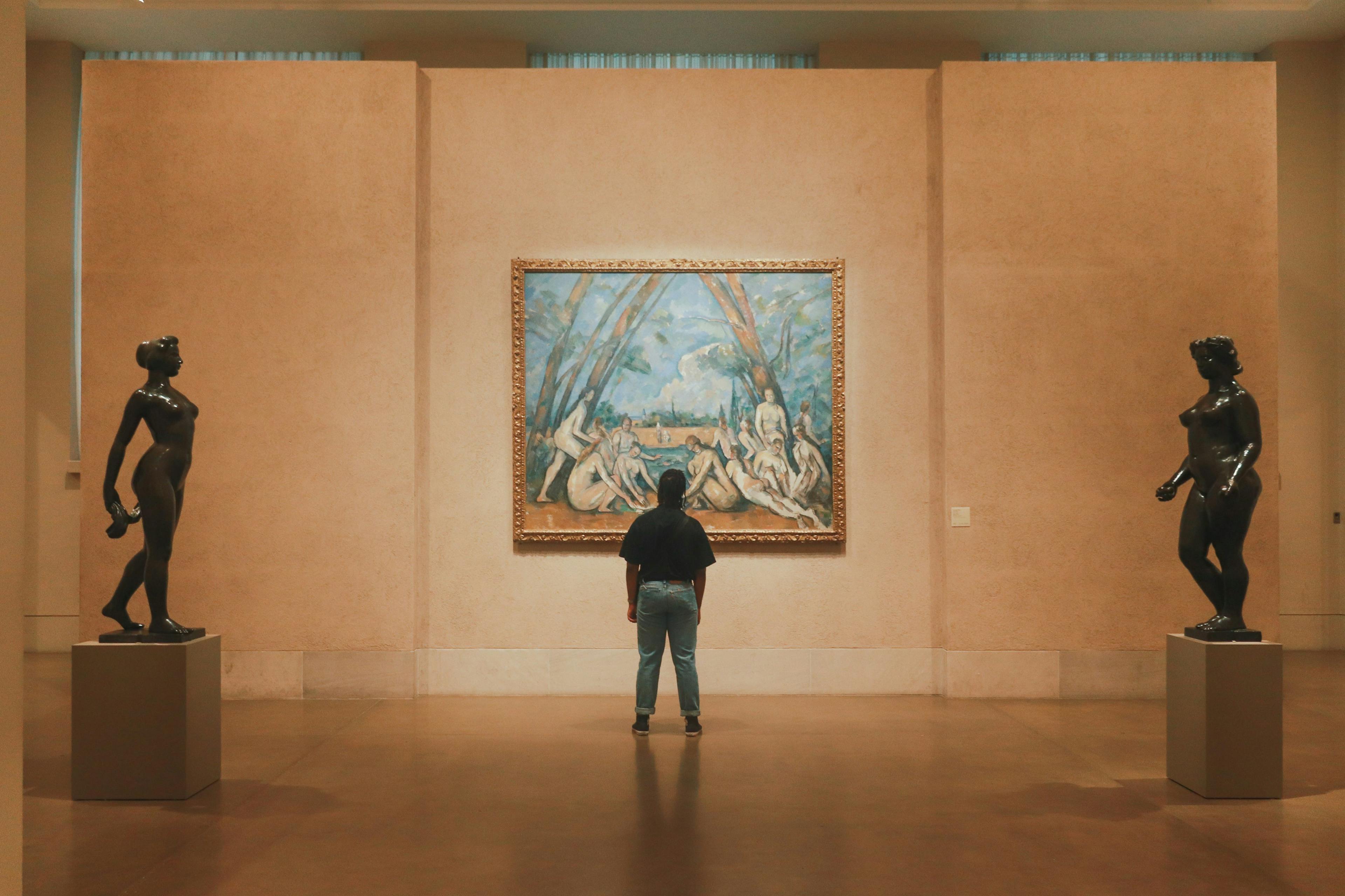 Man standing in front of artwork at the Philadelphia Museum of Art.