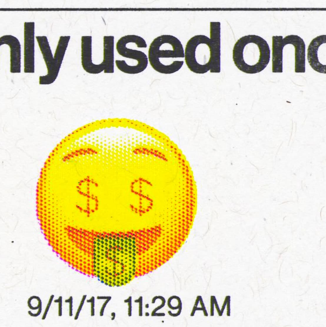 Macro shot of a yellow emoji with dollar signs for eyes and a smile. Caption below reads "only used once" and a timestamp "9/11/17, 11:29 AM", highlighting the print quality of the risograph.