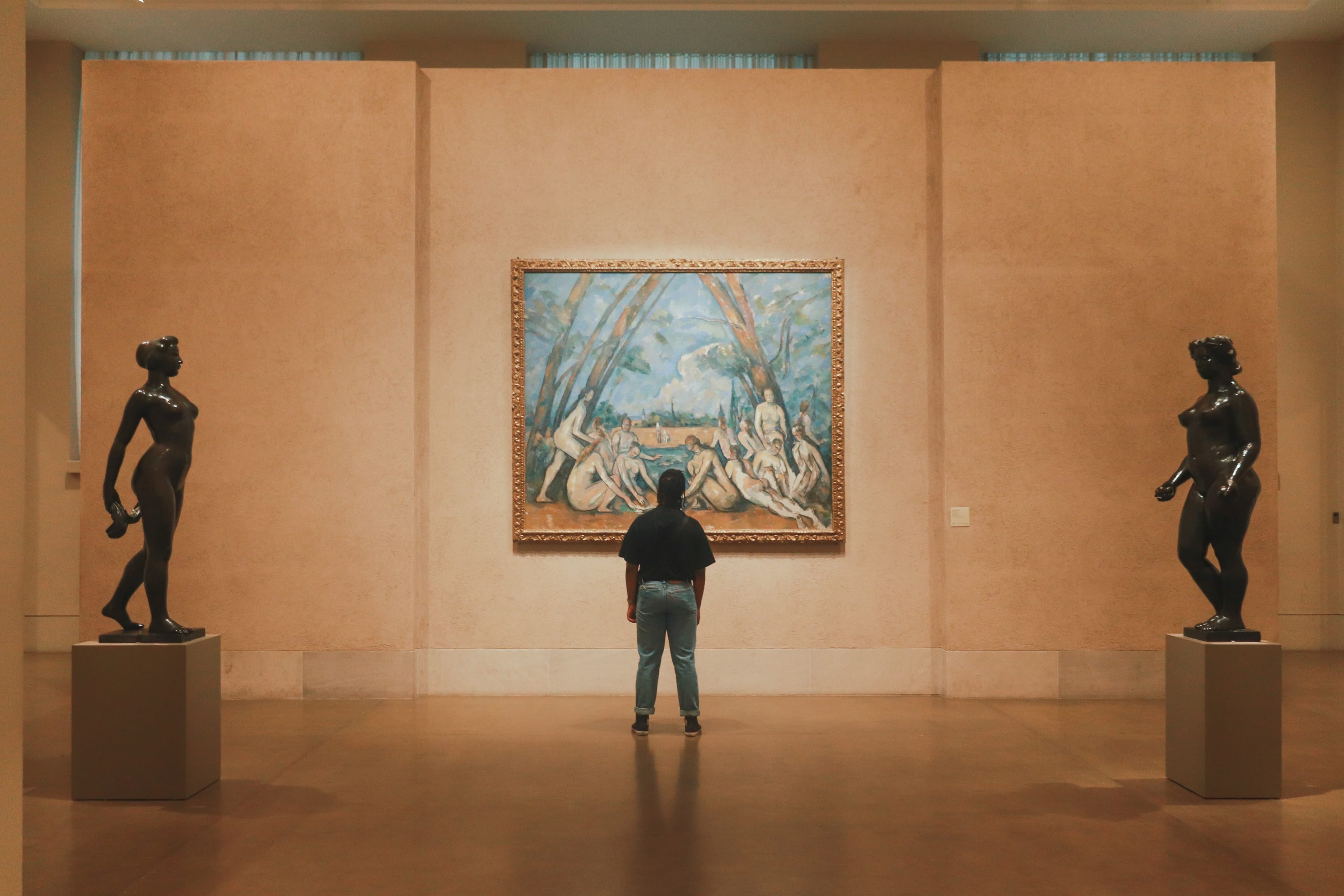 Man standing in front of artwork at the Philadelphia Museum of Art.